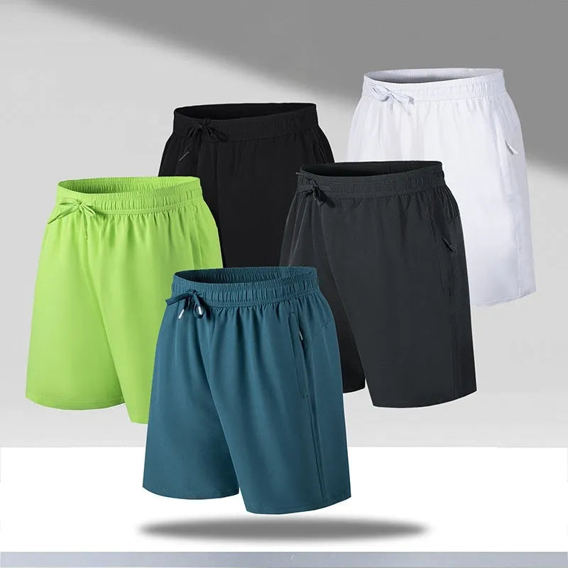 Man wearing loose-fit black quick-dry sports shorts made from ice silk polyester fabric.