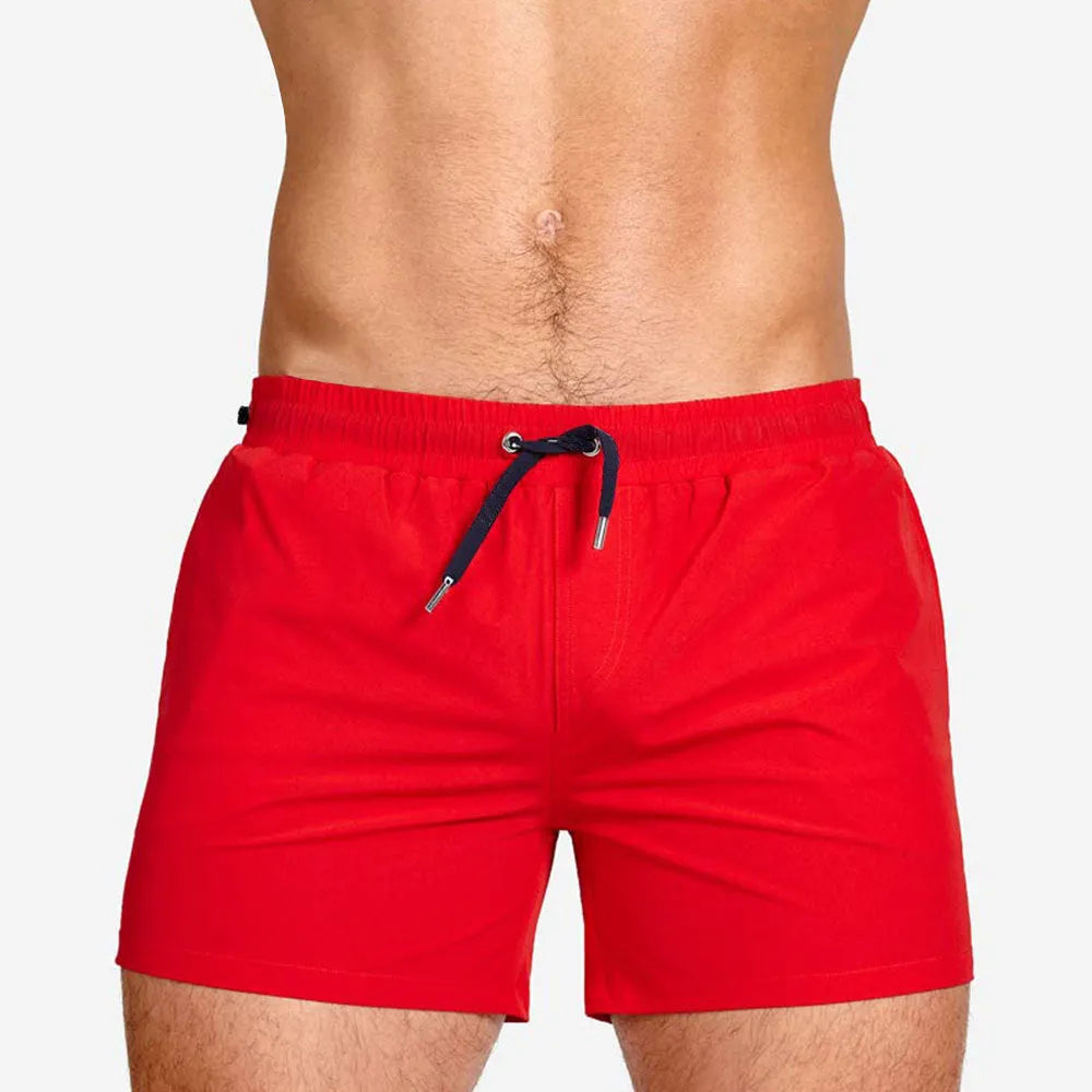 Men's solid colour polyester swimming shorts with mesh lining shown in multiple colours