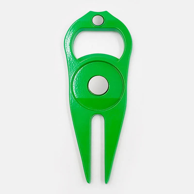 Black zinc alloy golf ball yoke and bottle opener tool with 25mm coin on putting green