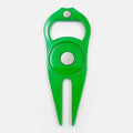 Black zinc alloy golf ball yoke and bottle opener tool with 25mm coin on putting green
