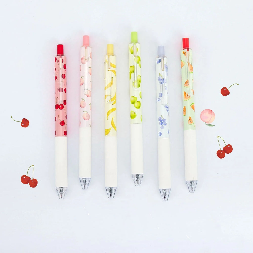 Three scented fruit pens with 0.5mm black ink and press mechanism on white background