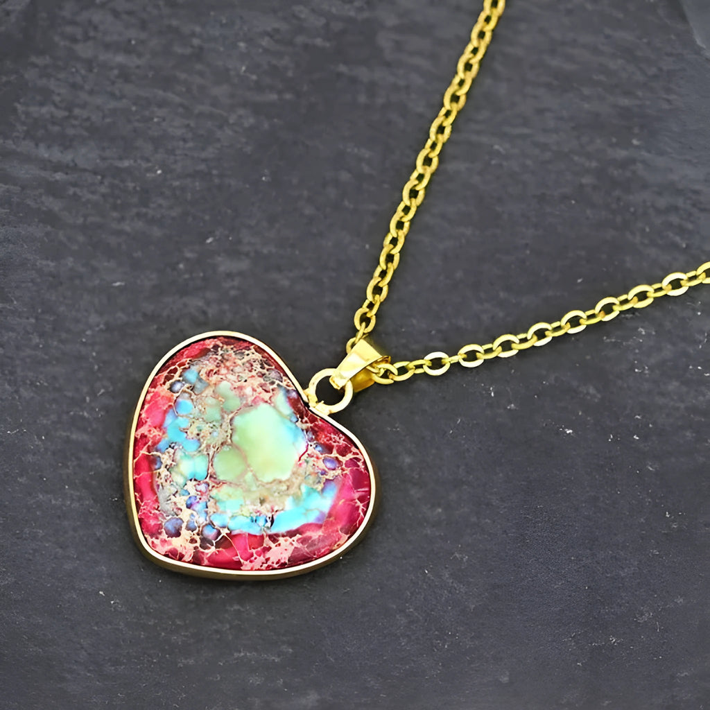 Red and blue heart-shaped emperor stone pendant necklace on a metal chain
