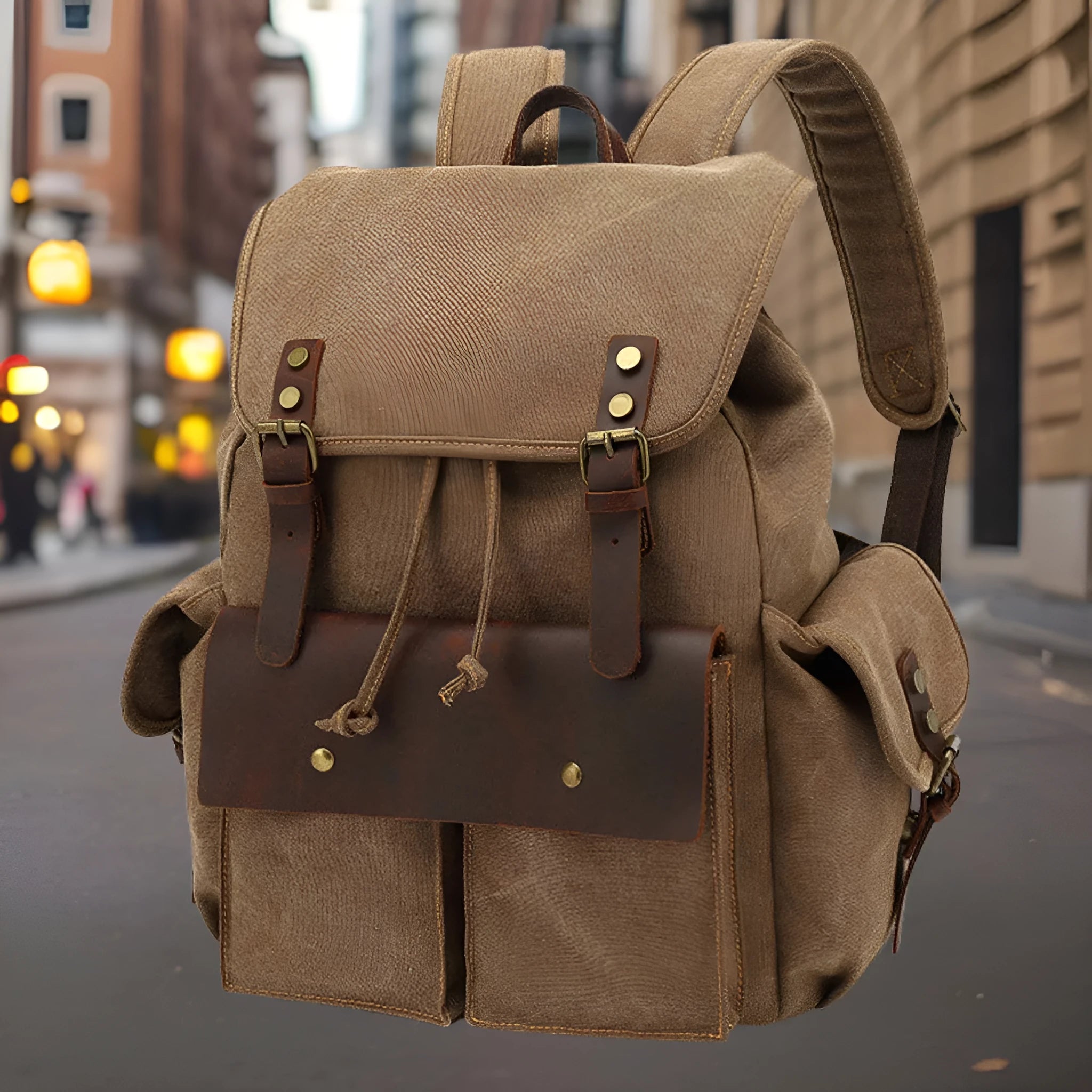 Retro-style army green canvas backpack with antique bronze hardware, shown closed.