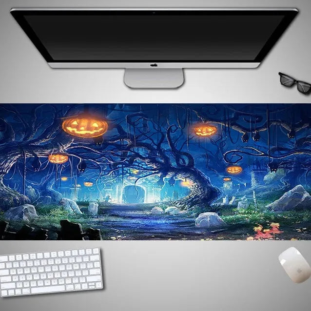 Oversized rectangular Halloween-themed mouse pad on a desk, showing non-slip rubber cloth base.