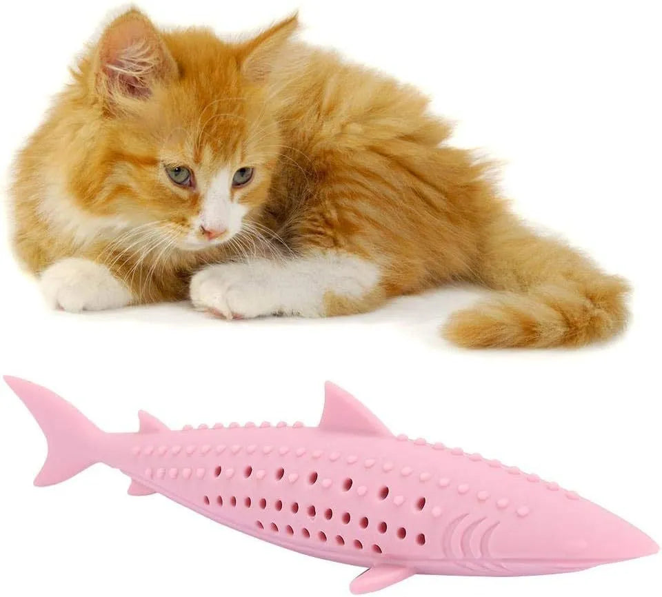 Green silicone dolphin-shaped cat chew toy on a white background, showing side air holes.