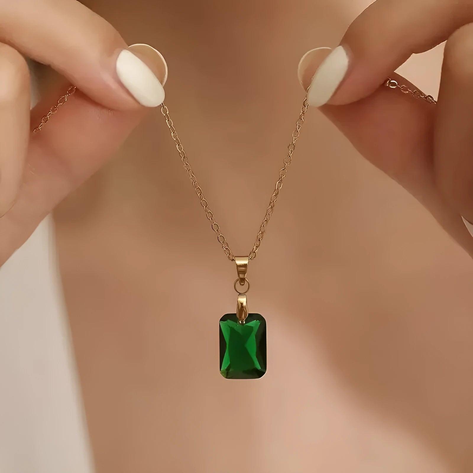 Rectangular geometric copper necklace with quadrilateral design on green background