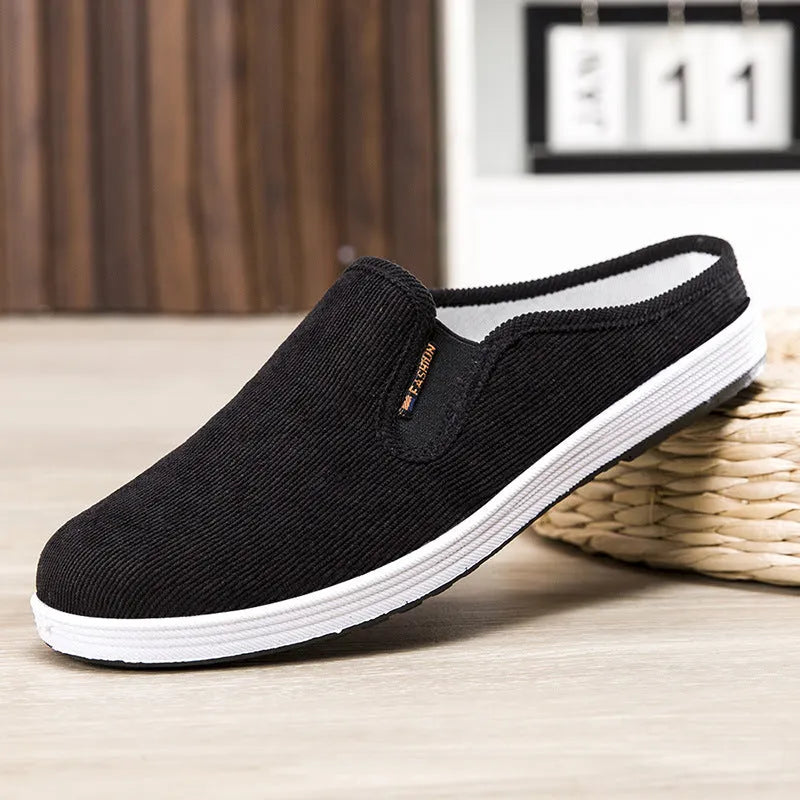 Men's casual slip-on sneakers in black with non-slip rubber sole and mesh lining
