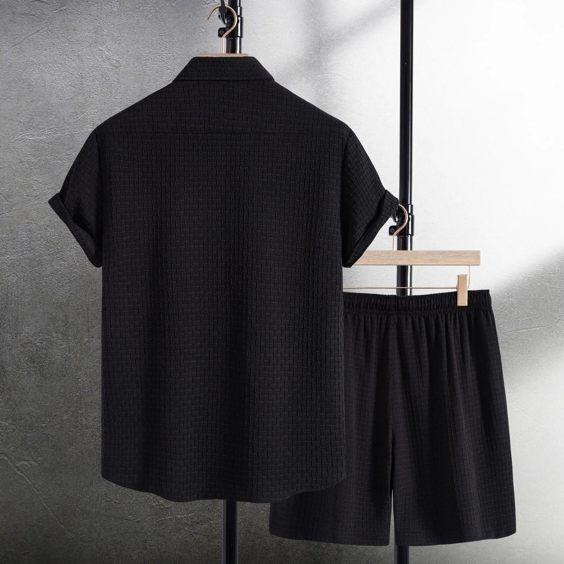 Men's loose-fit cotton blend shirt and shorts co-ord set in solid black colour.