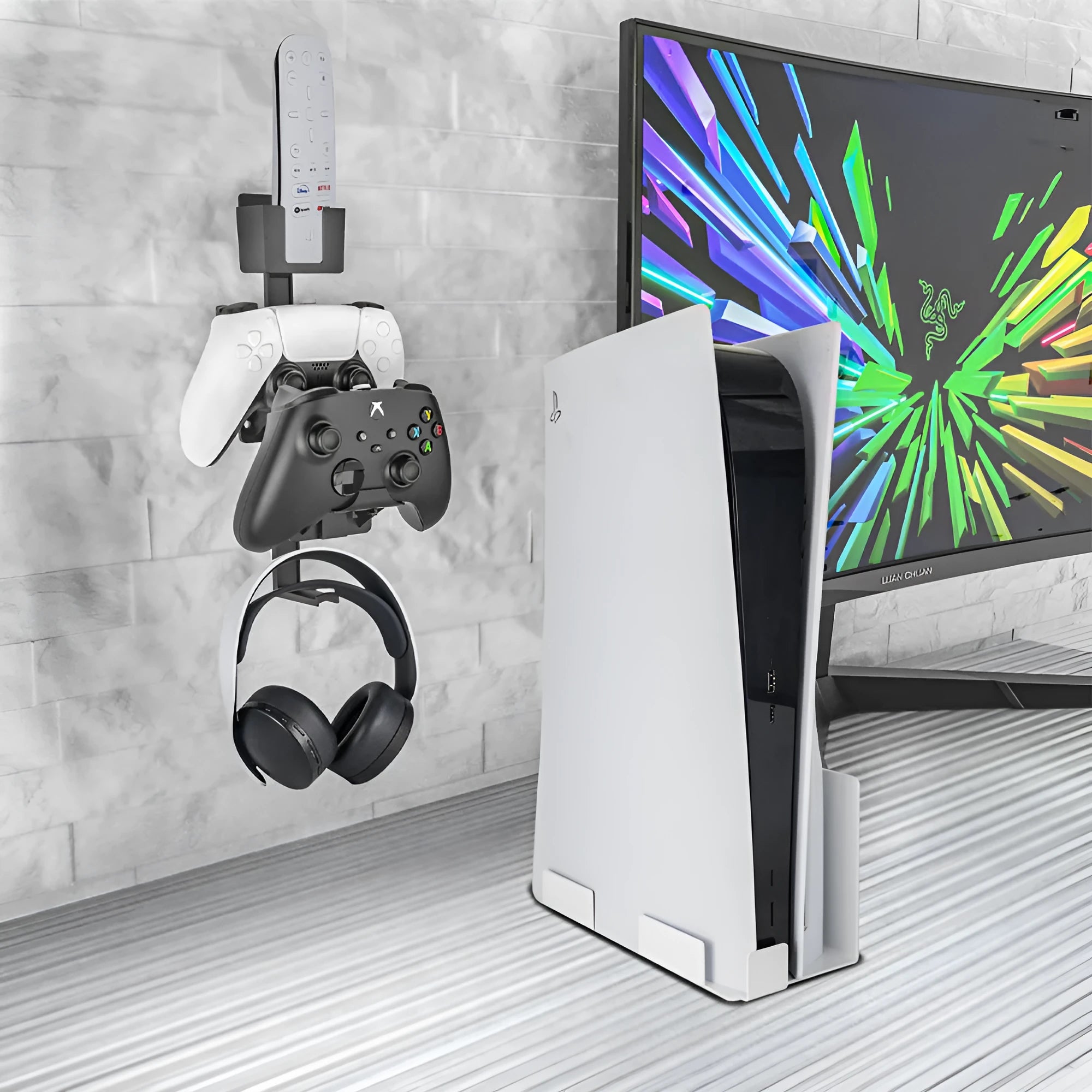 White adhesive wall hook holding a PS5 controller and gaming headset.