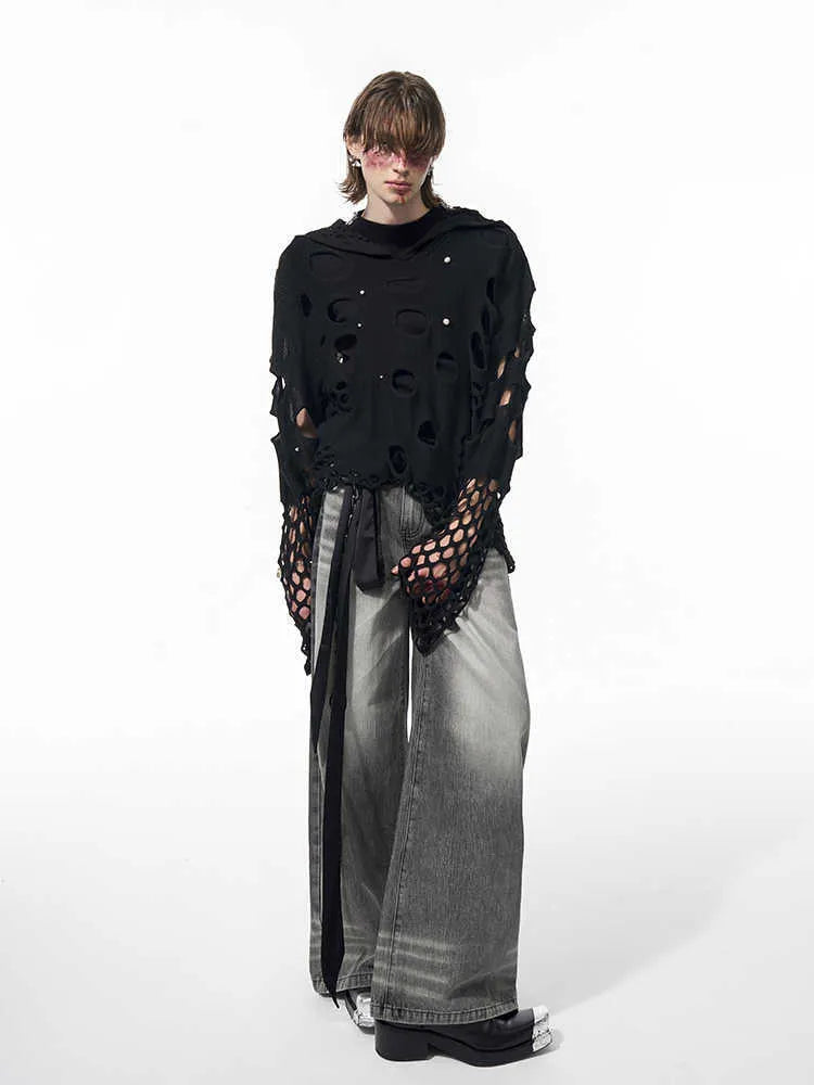 Black men's hoodie with pearl decoration showing loose fit and regular sleeves