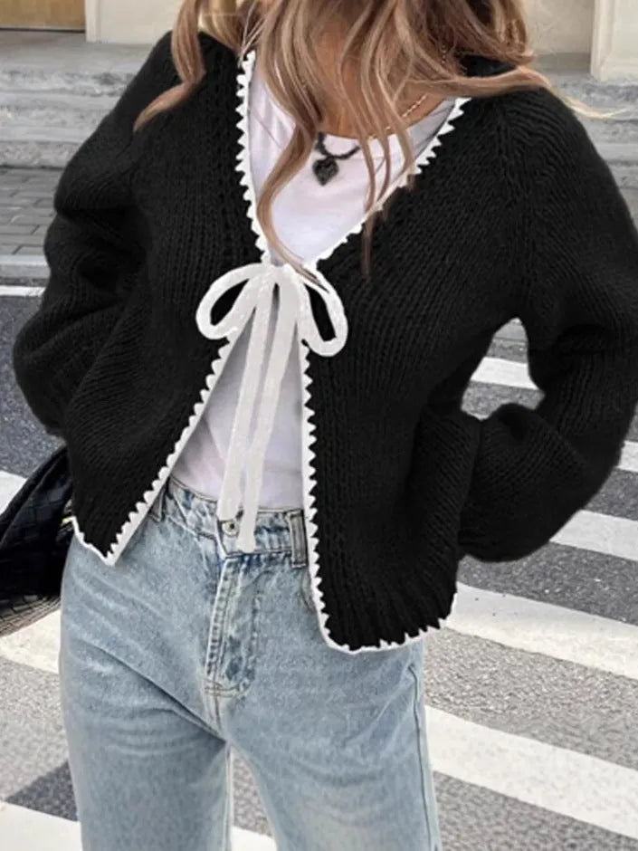 Women's gray loose-fit cardigan with long sleeves and white crochet flower details on the front.