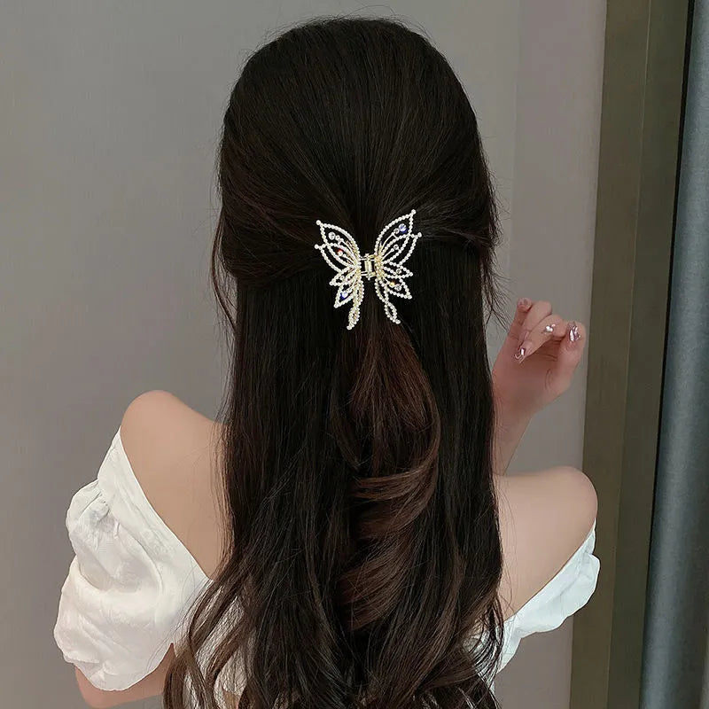 Butterfly-shaped hair barrettes for women with alloy construction and decorative rhinestone or pearl styling