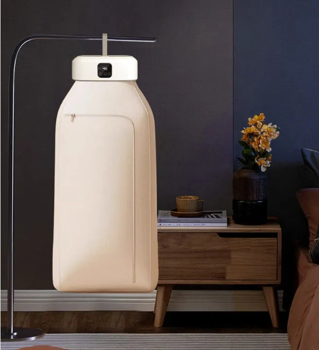 White cylindrical foldable clothes dryer with remote control showing compact 29cm height dimensions