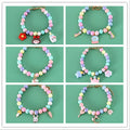 Macaron-coloured resin pet collar headdress with moon, meteor, and crown decorations on a small dog