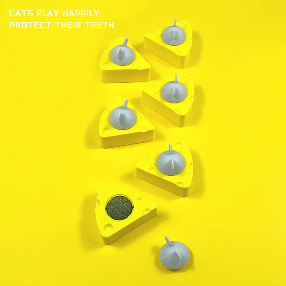 Yellow cheese-shaped catnip toy balls with silvervine chew sticks for cats