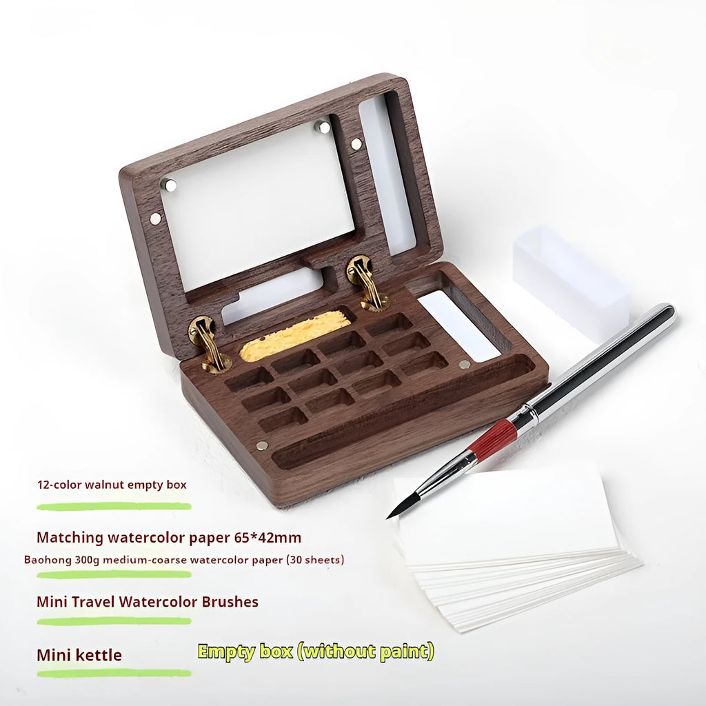 Miniature wooden watercolour paint box on a table, showcasing its compact size and walnut finish.