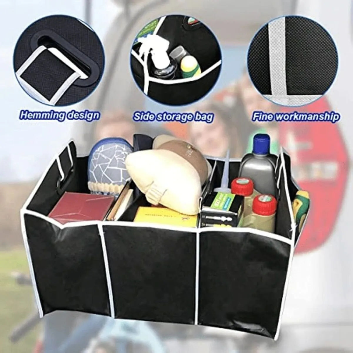 Black car multi-pocket trunk organiser with foldable lid and tie-down straps on car boot floor