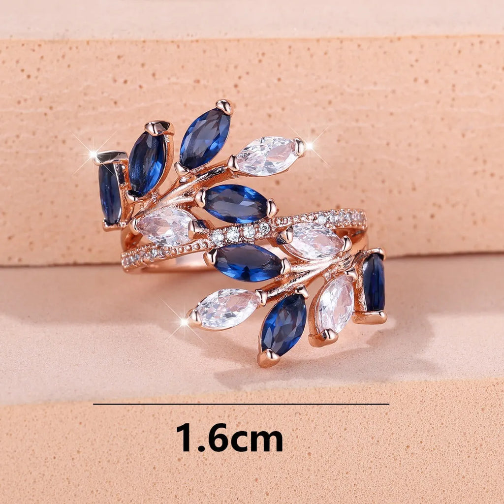 Adjustable copper leaf-shaped fashion ring with a central horse eye zircon stone in a rose gold finish.