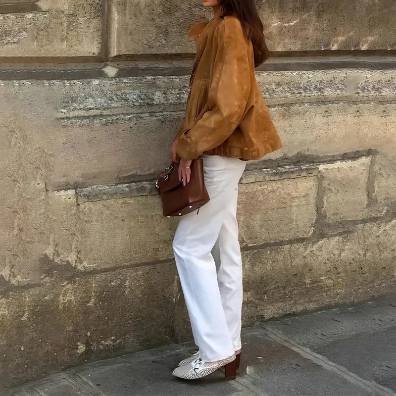 Man wearing a solid colour loose-fit retro polyester jacket