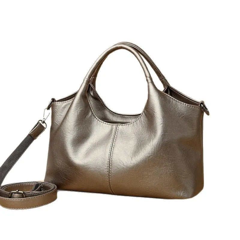 A genuine leather women's cross-body bag in a choice of seven colours including black, brown, and wine red.