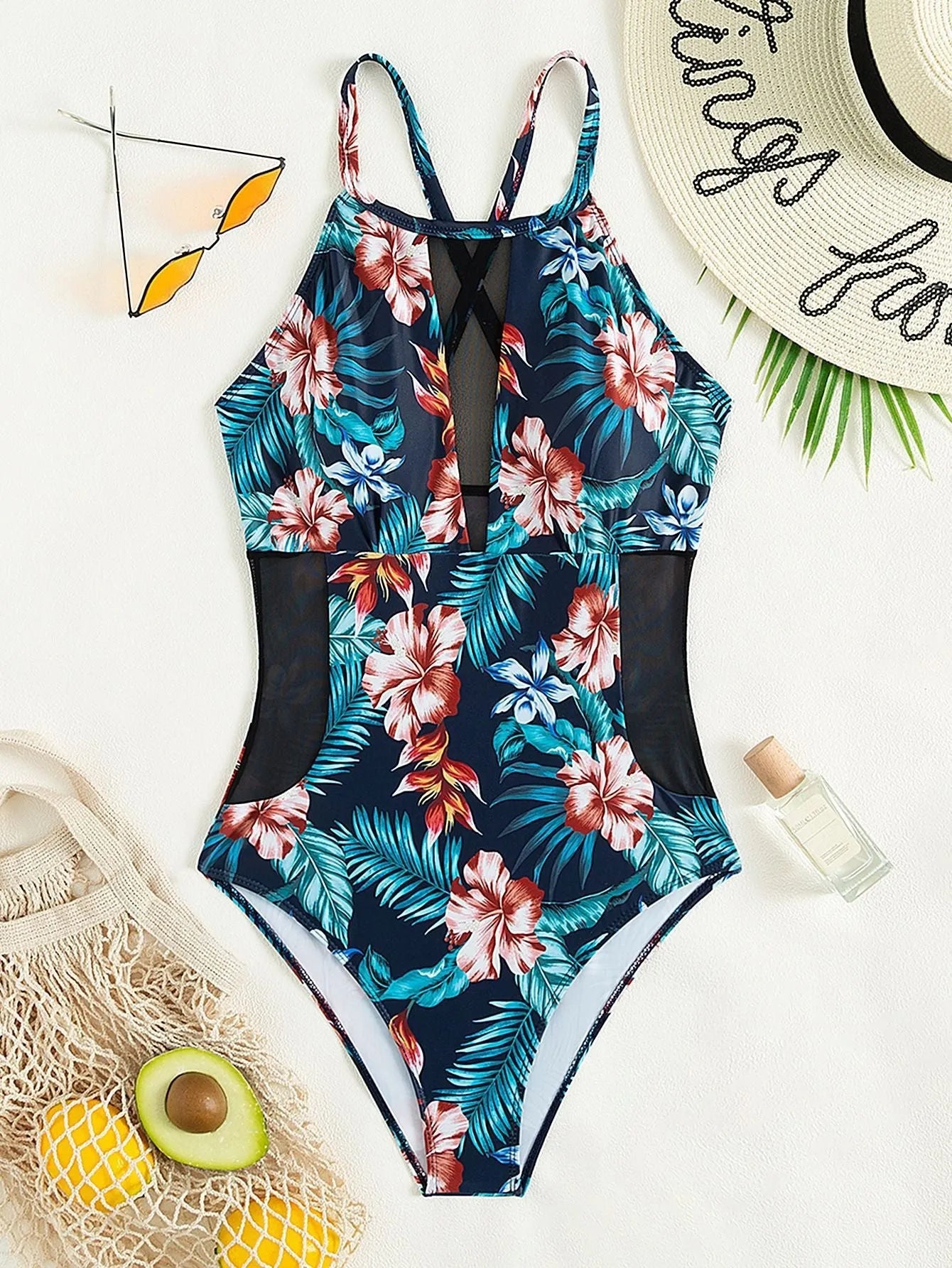 Women's printed one-piece swimsuit with deep V neckline on a mannequin, showing gradient colour design.