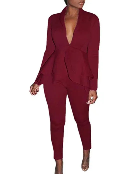 White ruffled business casual shirt and matching pencil pants set laid flat.