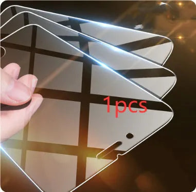 Tempered glass screen protector for iPhone models on a clean surface.