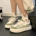Green women's casual shoes with PU mesh upper, round toe, and flat non-slip sole.