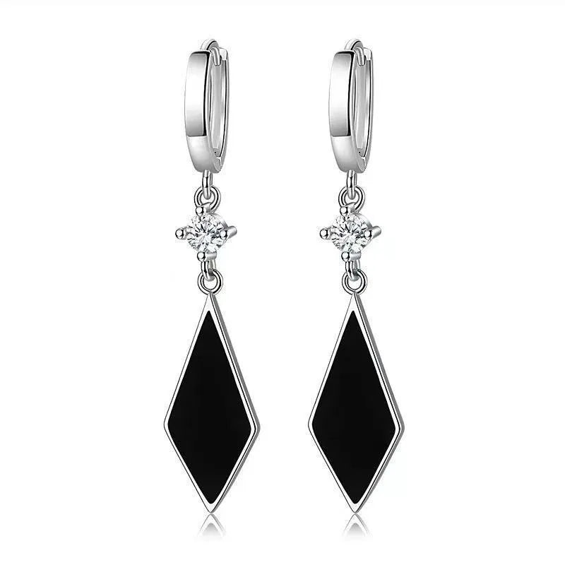 Silver geometric diamond-shaped clip-on fashion earrings with a vintage diamond finish.
