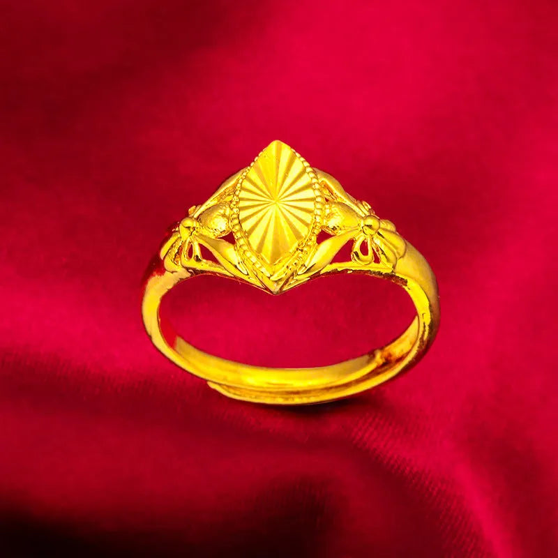 Gold electroplated open flower ring with geometric texture on adjustable brass band