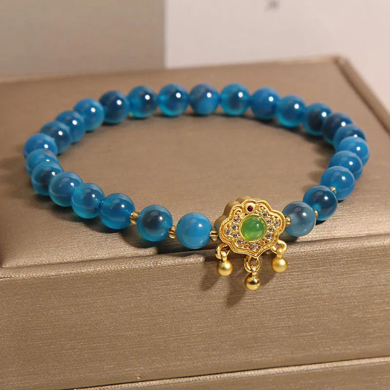 Women's blue agate safety lock pendant bracelet with crystal and rhinestone details
