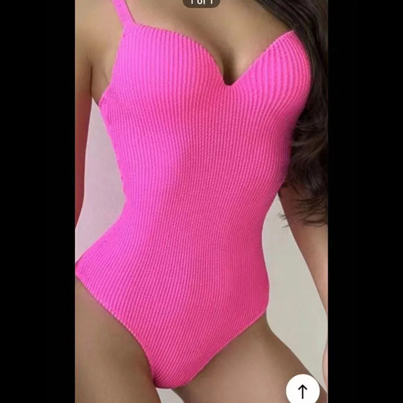 Women's black one-piece swimsuit with sunken stripe design for swimming activities