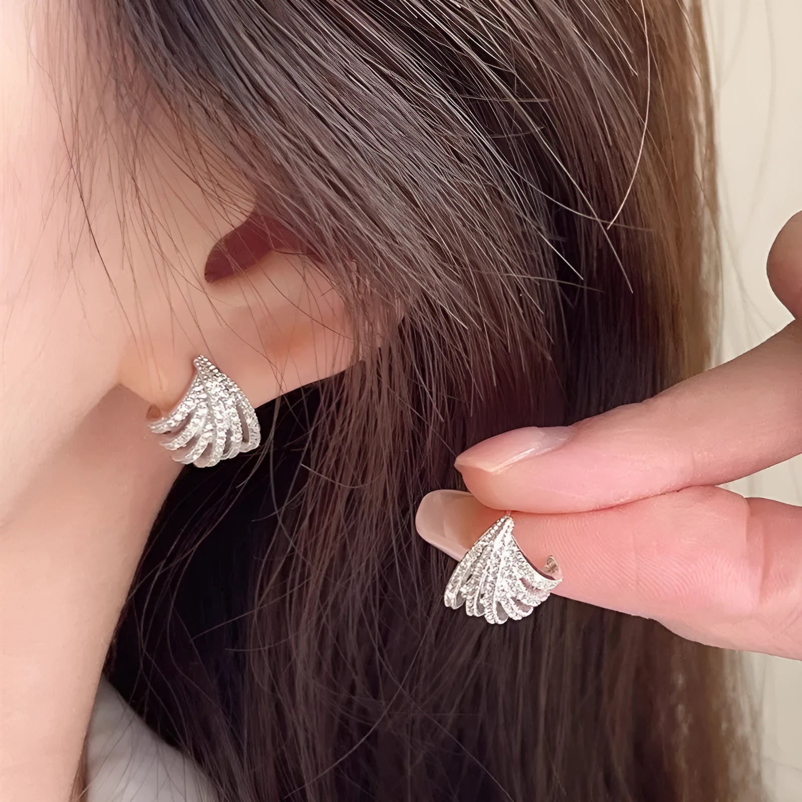 Geometric zircon earrings with platinum electroplated finish and line design detailing