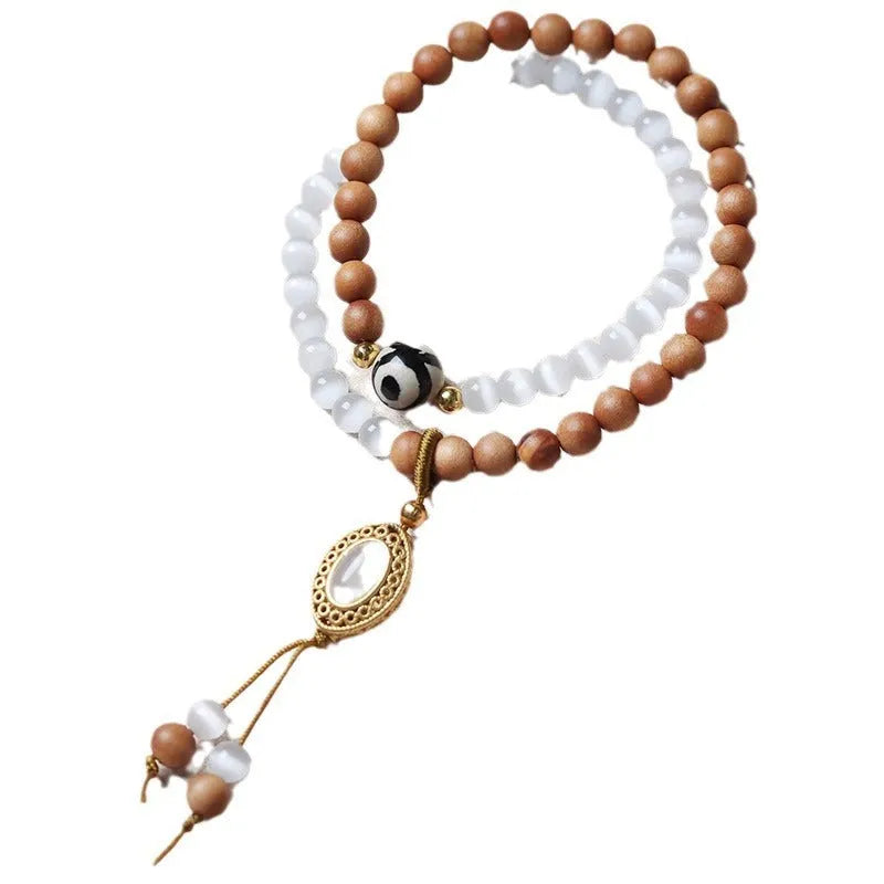 Sandalwood and opal Tibetan beads bracelet with polished double rings in Barbie colour
