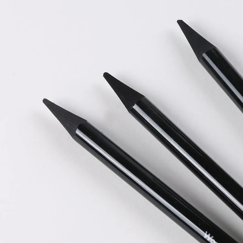 Set of nine wooden drawing pencils on a suction card, containing six graphite and three carbonized pencils for artist sketching.