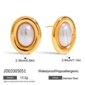A pair of stainless steel post ear studs with small vintage-style pearl accents on a silver-tone background.