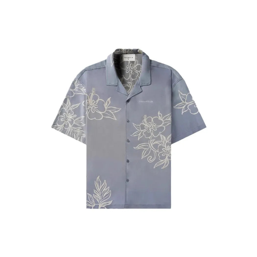 A man's loose grey short-sleeved cardigan with a floral print, showing the elastic band fabric.