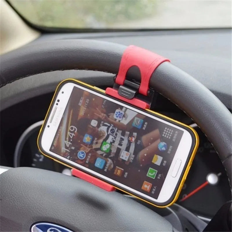 Universal black steering wheel phone mount holder clipped onto a car wheel