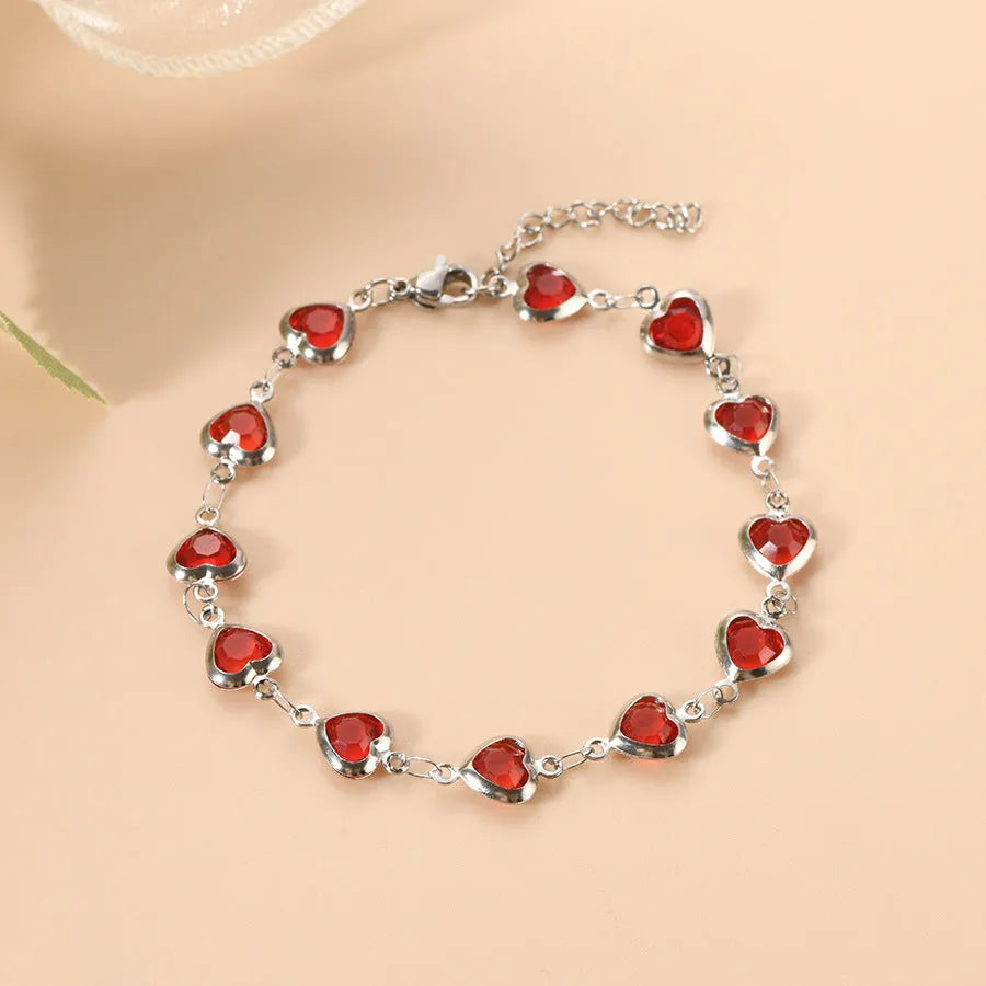 Devil's Eye geometric heart-shaped stainless steel bracelet in an electroplated colour on a wrist.