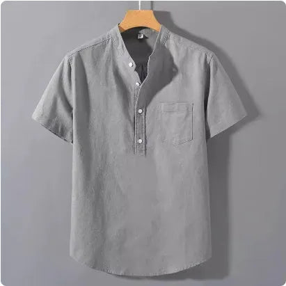 Men's loose-fit solid colour linen shirt with a stand collar and short sleeves on a hanger.