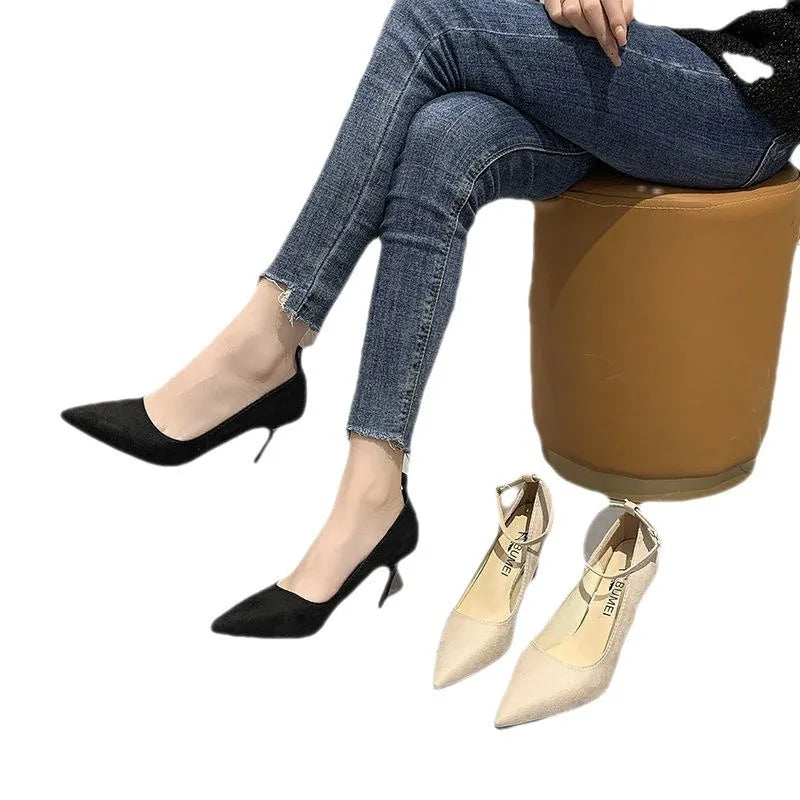 Women's black stiletto heel pump shoes with buckle detail and skull pattern
