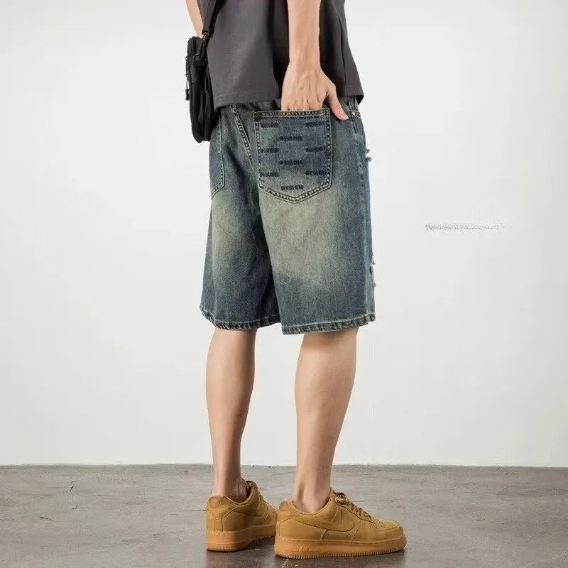 Men's blue retro wash loose fit denim shorts with straight legs on a mannequin.