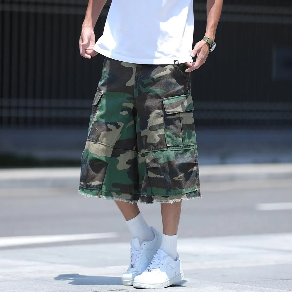 Man's loose-fit cotton shorts in a camouflage print with a cropped length and retro workwear style.