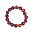Handmade watermelon crystal bracelet showing pastoral design details on a wrist.