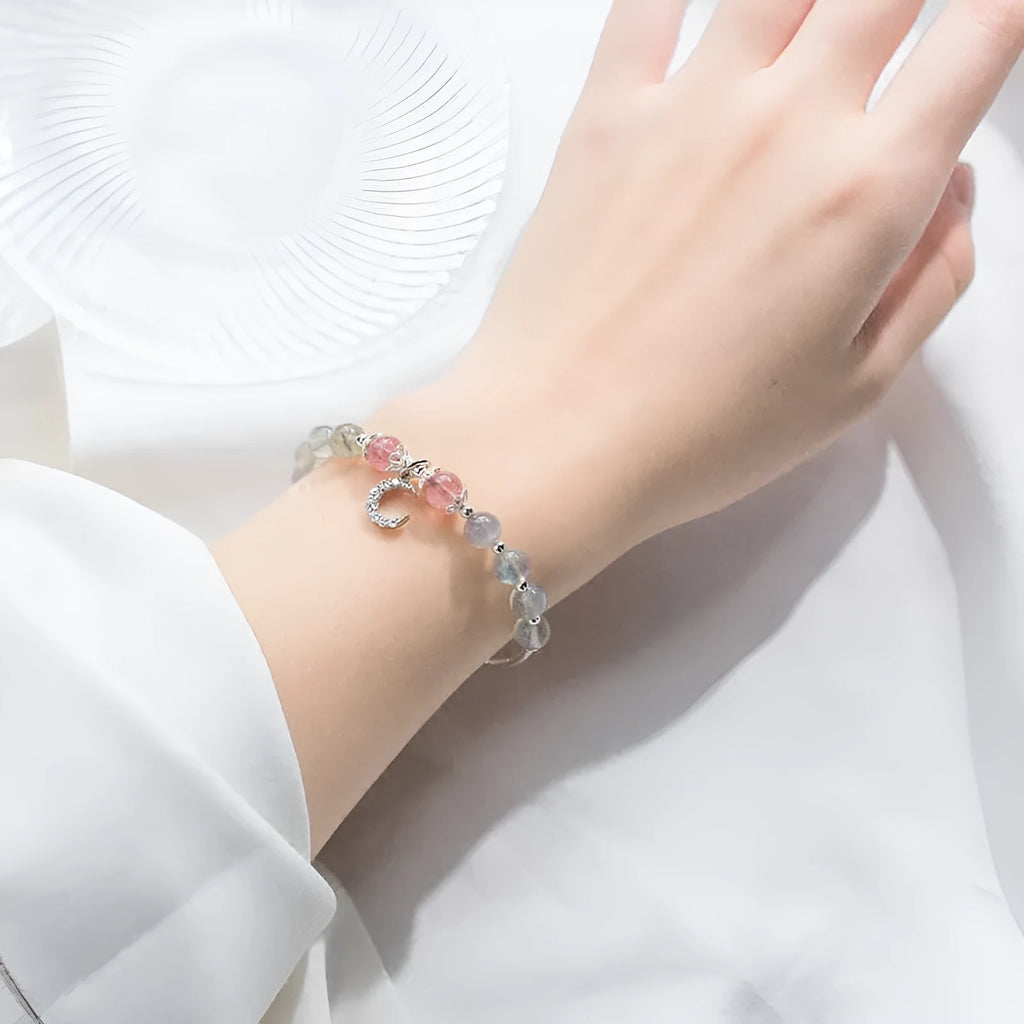 Handmade adjustable moonstone bracelet with crescent moon charm showing 6mm beads and extension chain