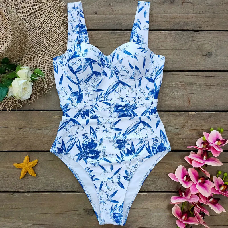 One-piece white polyester swimsuit for women with printed pattern and flab hiding gather design