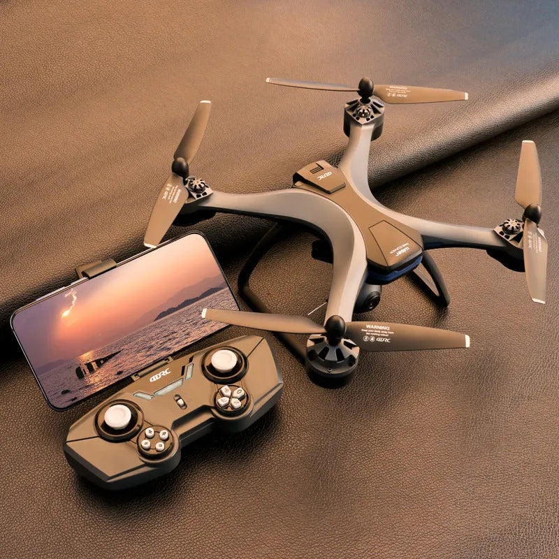 Plastic quadrocopter drone with four rotors, a remote controller, and spare blades on a blue background.