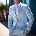 Men's blue British-style suit jacket with white buttons, straight hem, and double-button front