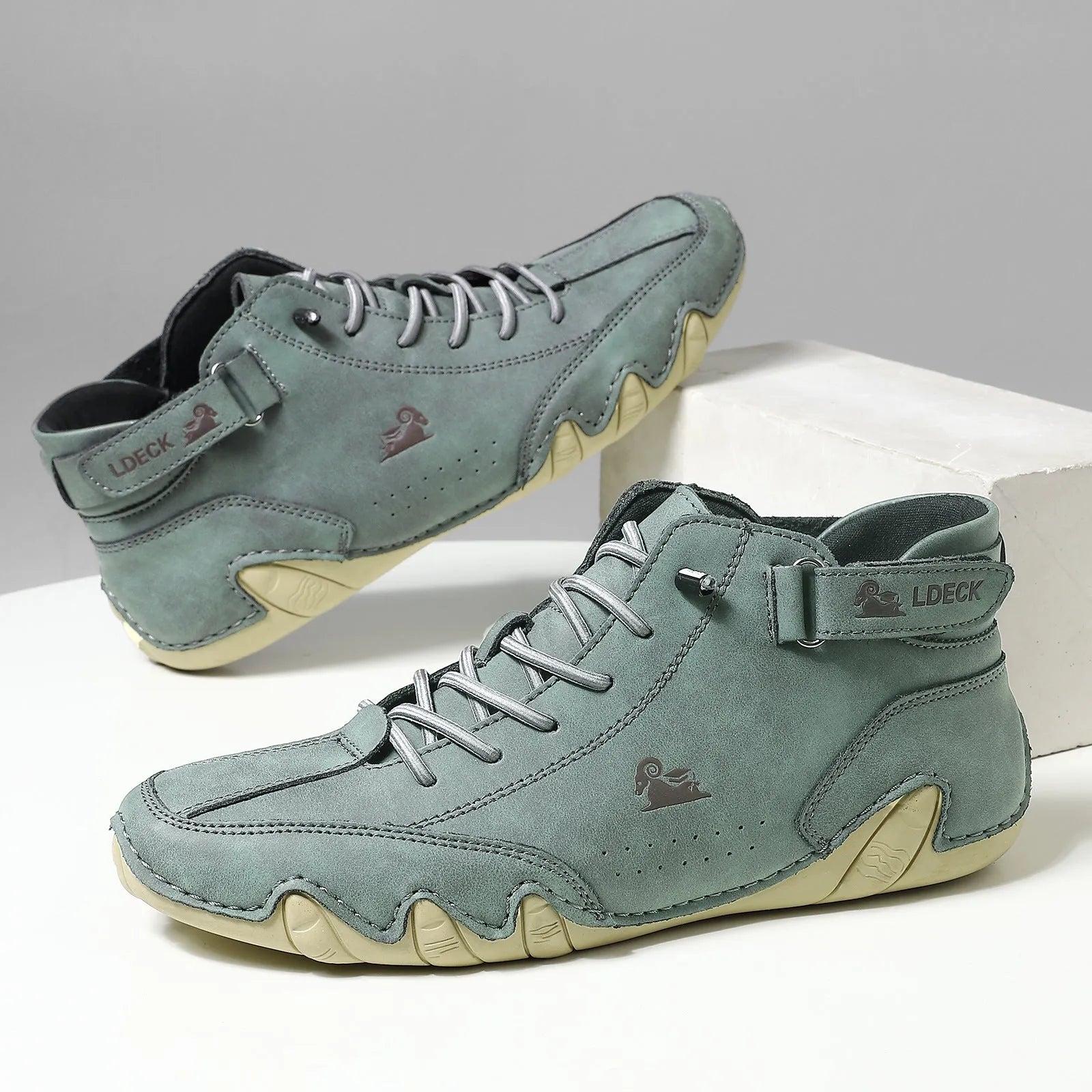 Men's octopus style high top boots in khaki colour with a microfiber upper and flat rubber sole.