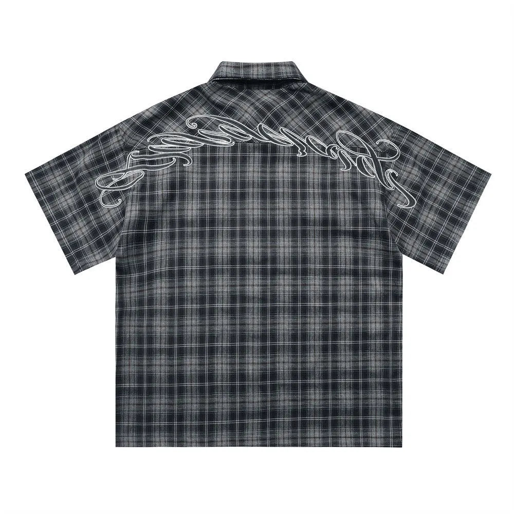 Men's black and brown plaid short sleeve shirt with embroidered letter on lapel